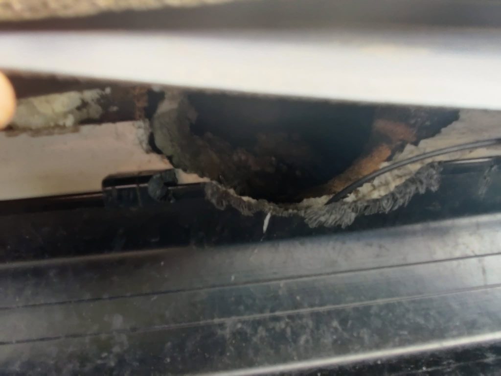 Hole in a fascia caused by squirrels