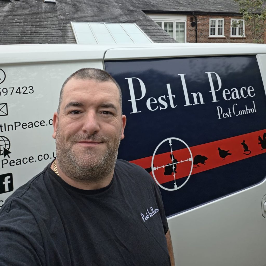 Mike in front of the branded Pest In Peace van